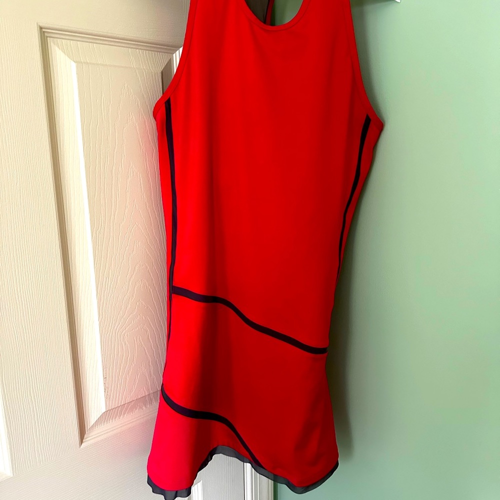 Tennis dress by Uphorm size 4 never worn. Like new. With cool T- back.